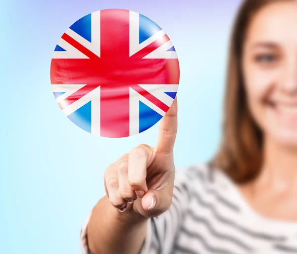 Mujer apuntando a la burbuja con bandera inglesa — Foto de Stock