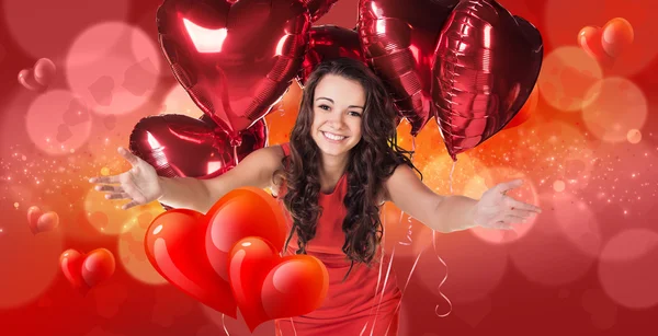 Mujer en vestido rojo se levanta sobre fondo bokeh —  Fotos de Stock