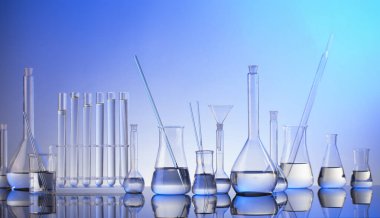 Laboratuvar araştırmaları. Mavi arka planda cam tüpler ve beherler.