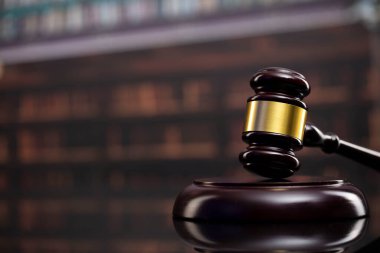 Law theme. Court library - gavel of the judge, scale and books.