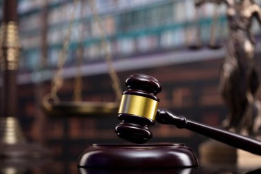 Law theme. Court library - gavel of the judge, scale and books.