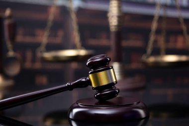 Law theme. Court library - gavel of the judge, scale and books.
