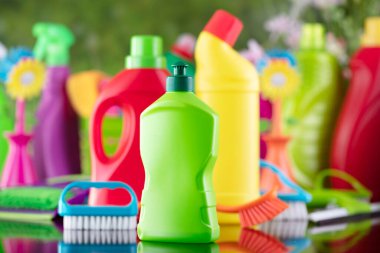 Spring house and office cleaning. Cleaning kit and sources on the glass table. Bokeh  background.