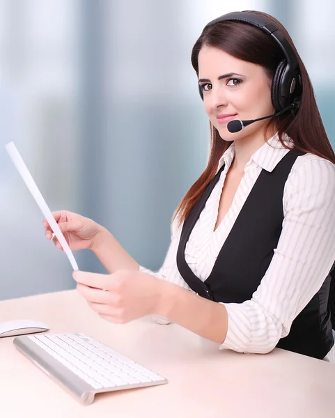 Portrait of young secretary with headset — Stock Photo, Image