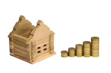 Ahşap ev blok sikke ile. (finans, özellik ve ev kavramı borç). Proje rahat ev. Yeni bina ayrıntılarını ve inşaat için para. Yeni bir ev satın alma.