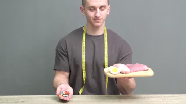 A man holds food with a high protein content for proper nutrition — Stock Video