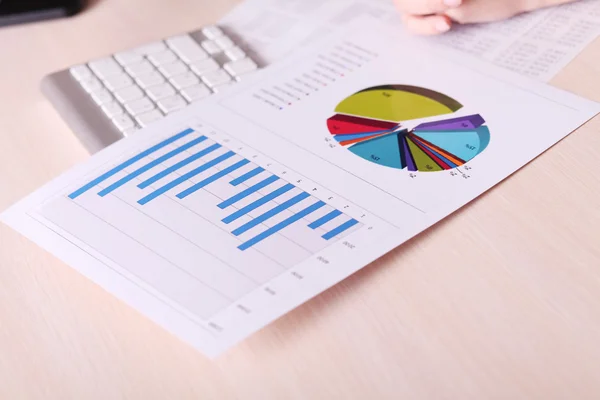 Financial charts and graphs on the table — Stock Photo, Image