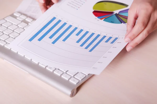 Financial charts and graphs on the table — Stock Photo, Image