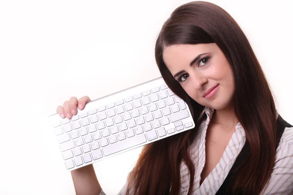 Joven mujer feliz sosteniendo el teclado sobre fondo blanco —  Fotos de Stock