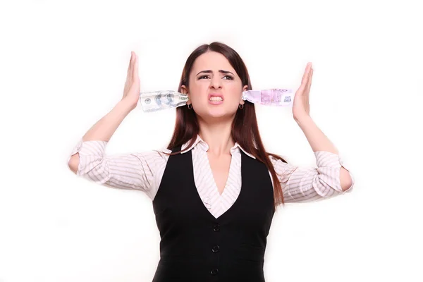 Angry business woman holding money in the ears — Stock Photo, Image