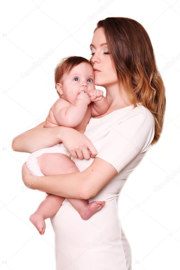 happy mother and baby laughing in the studio 