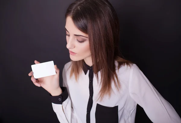 Attractive female holding her credit card — Stock Photo, Image