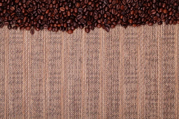 Roasted coffee beans on wood background — Stock Photo, Image