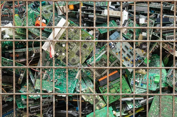 Scrap yard printed circuit board electronic waste for recycling with selective focus. main board electronic waste