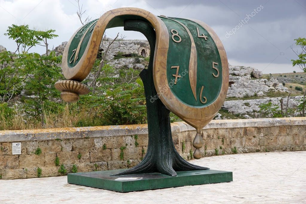 Dance of Time II by Salvador Dali at the Sassi of Matera in Matera, Italy. The Sassi of Matera are two district, Sasso Caveoso and Sasso Barisano, of the italian city of Matera, Basilicata, known for their ancient cave dwellings inhabited since the P
