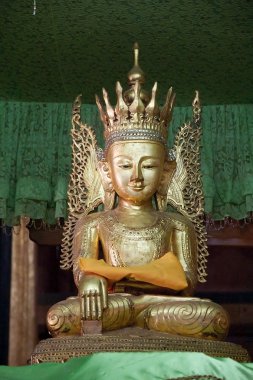 Buddha image at Nga Phe Chaung Monastery Myanmar clipart