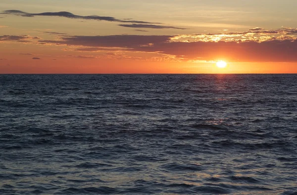 Cloudscape and sunset over the sea — Stock Photo, Image