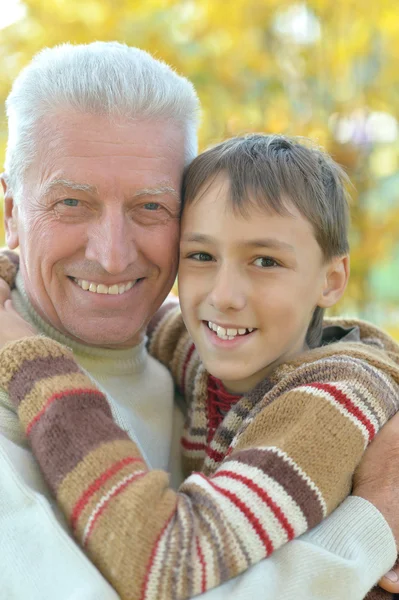 Grandfather and grandson in park — Stock Photo, Image