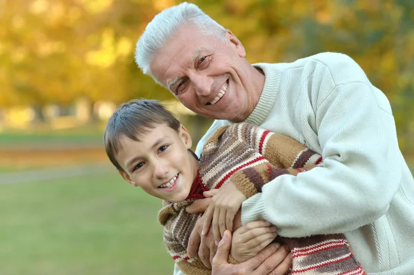Grandfather and grandson in park — Stock Photo, Image