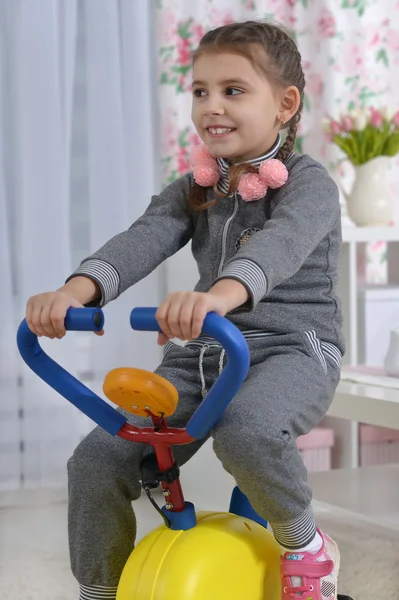 Little girl doing  exercise — Stock Photo, Image