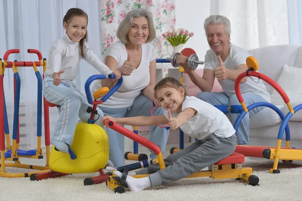 Grandparents  and  granddaughters doing exercise — Stock Photo, Image