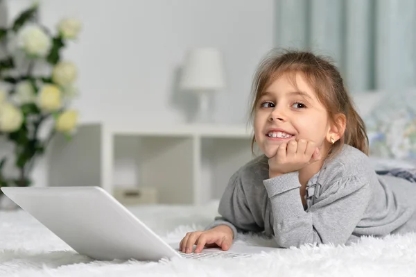 Cute little girl with   laptop — Stock Photo, Image