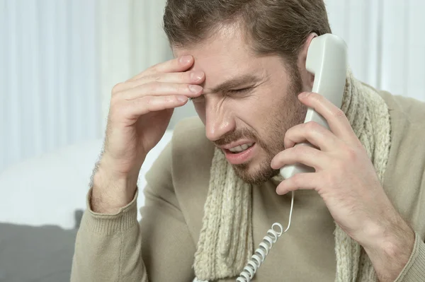 Sick man  calling his doctor — Stock Photo, Image