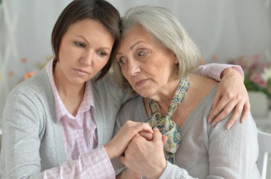 miserable mother and adult daughter clipart