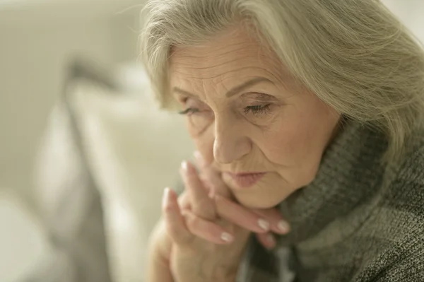 Melancholy senior woman — стоковое фото