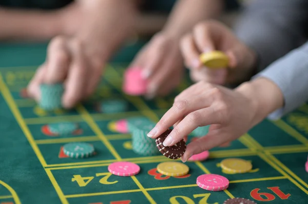 Hands with  casino chips — Stock Photo, Image