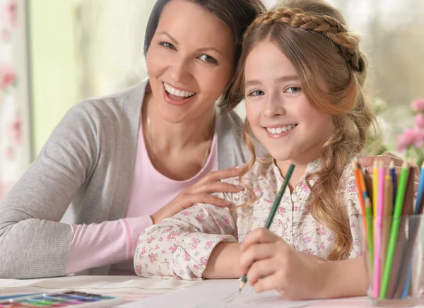 Smiling woman and a young girl — Stock Photo, Image
