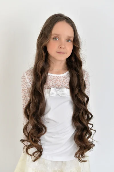 Beautiful little girl with long hair — Stock Photo, Image