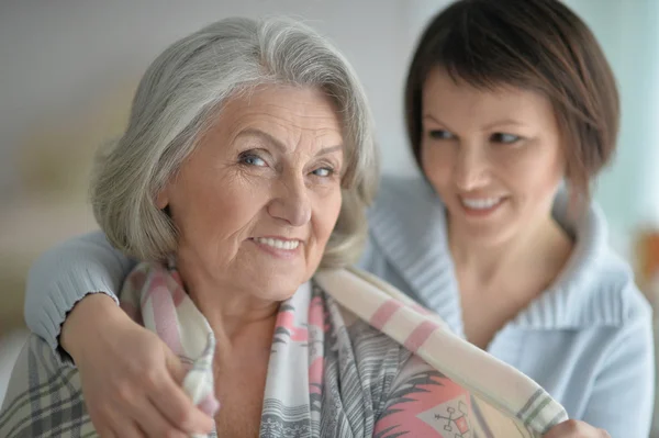 Cheerful mother and adult daughter — Stock Photo, Image