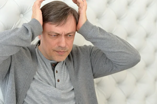 Handsome mature man with headache — Stock Photo, Image