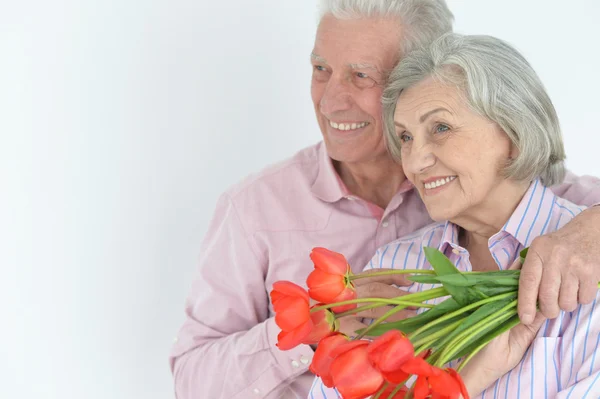 Mature couple with poppies — Stock Photo, Image