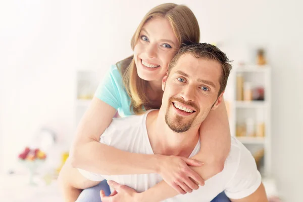 Young couple standing at home — Stock Photo, Image