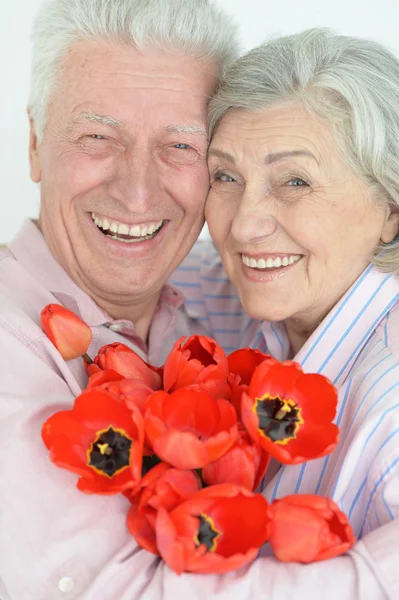 Mature couple with poppies Royalty Free Stock Photos