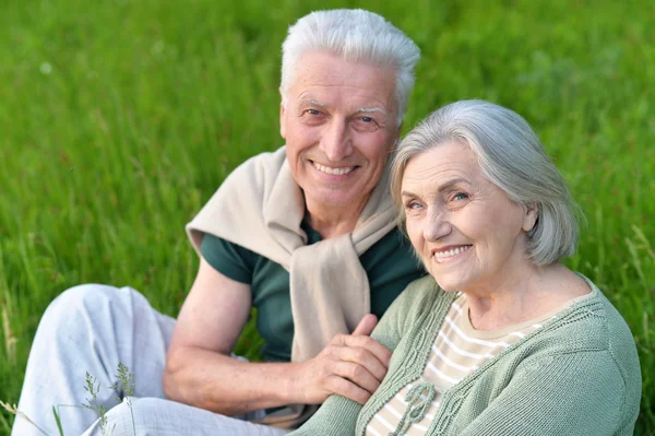 Mature couple   in summer park — Stock Photo, Image