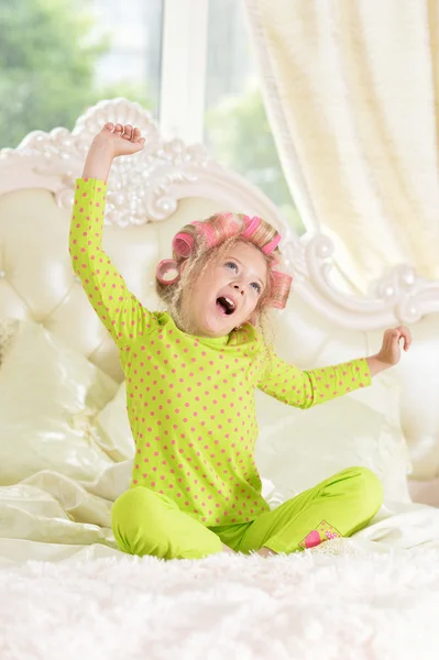 Girl in hair curlers awaked up — Stock Photo, Image