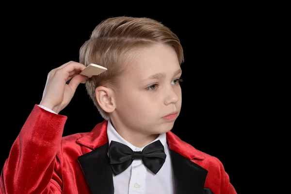 Handsome little boy in a tuxedo — Stock Photo, Image