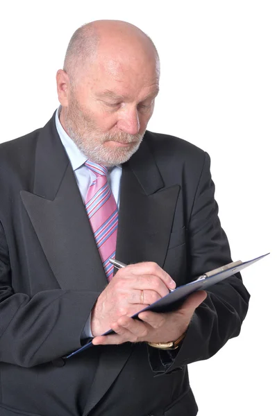 Elderly  businessman with clipboard — Stock Photo, Image