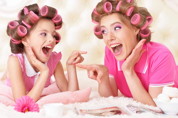 Mother and daughter in hair curlers — Stock Photo, Image