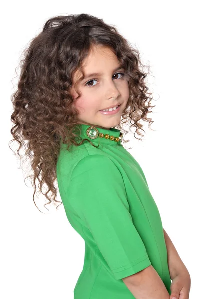 Bambina in posa in abito verde — Foto Stock