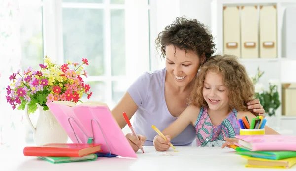 Woman and  girl with colored pencils — Stock Photo, Image