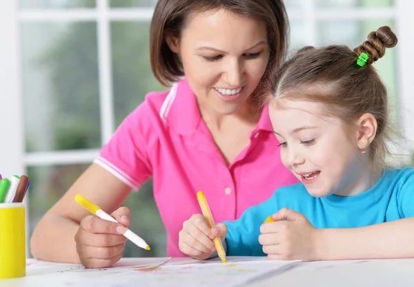 Woman and  girl with colored pencils — Stock Photo, Image