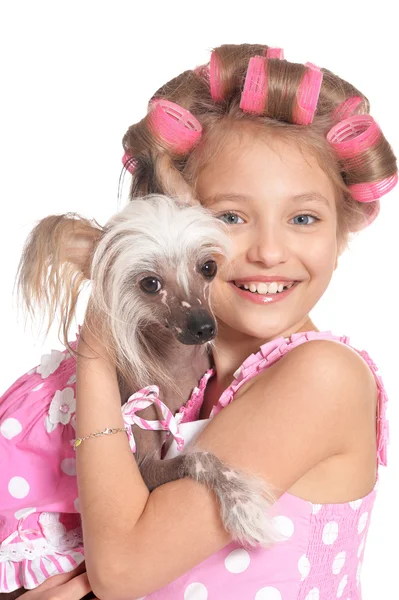 Niña en rizadores de pelo con perro —  Fotos de Stock