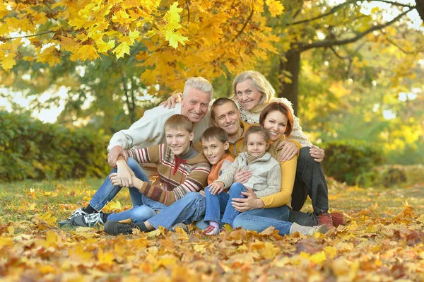 Family  in autumn park — Stock Photo, Image
