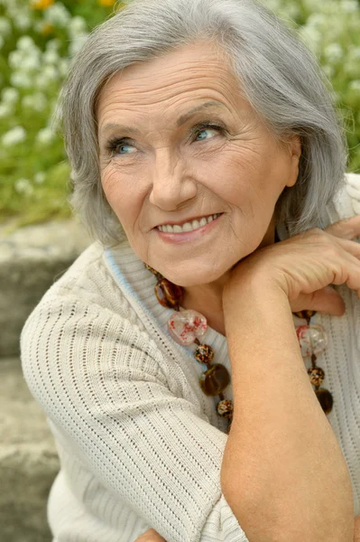 Mature couple in spring park — Stock Photo, Image