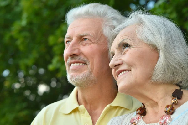 Mature couple in spring park — Stock Photo, Image