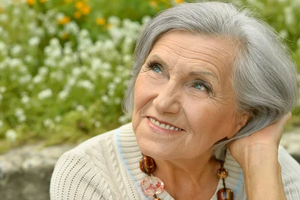 Mature couple in spring park Royalty Free Stock Photos